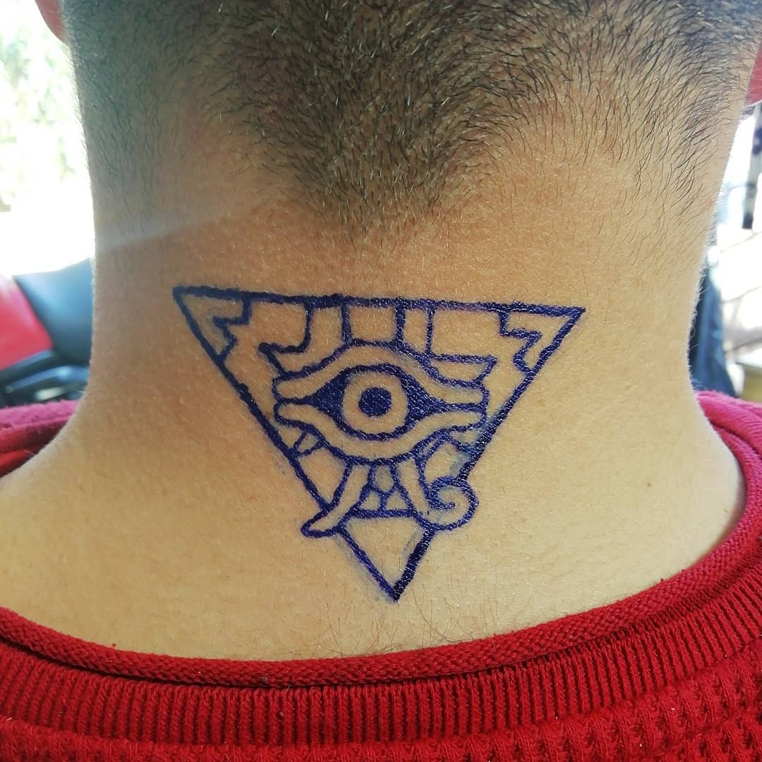 An individual with an eye symbol tattoo in a triangle on the back of their neck